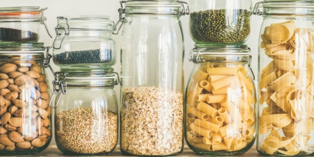 A group of glass jars with different types of food AI-generated content may be incorrect.