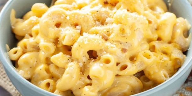 A bowl of macaroni and cheese AI-generated content may be incorrect.