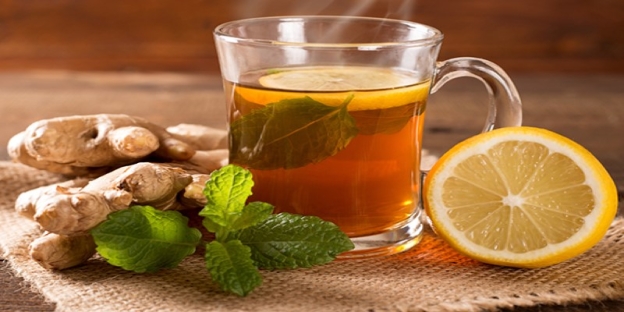 A cup of tea with lemon and ginger AI-generated content may be incorrect.