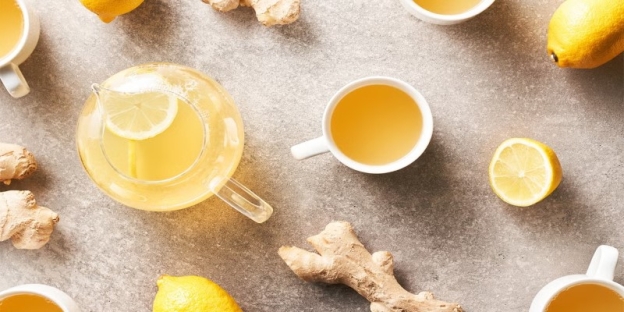 A cup of tea with lemons and ginger AI-generated content may be incorrect.